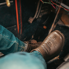 Person wearing Westech Outrider slip-on shoe in Barrel Brown while driving, showing the comfortable Western design in real-life use, made in the USA