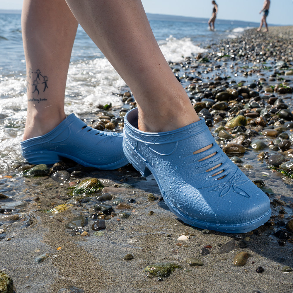Person wearing Westech Outrider slip-on shoes in Robin's Egg Blue, bright and comfortable Western footwear for everyday adventures, Made in USA